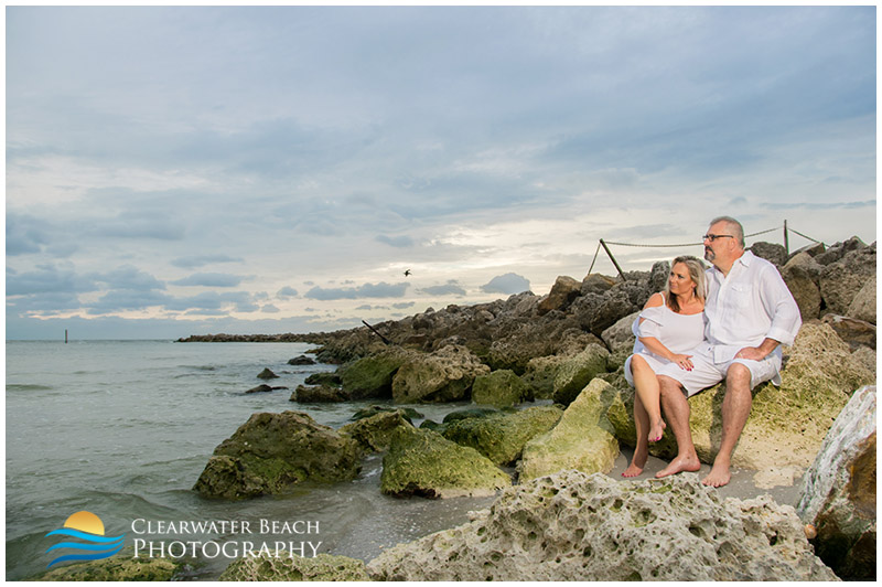 photo of couple on rocks at sand key beach