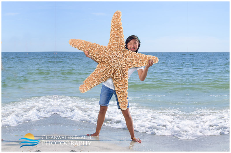 Photograph of girl holding giant star fish on Clearwater Beach