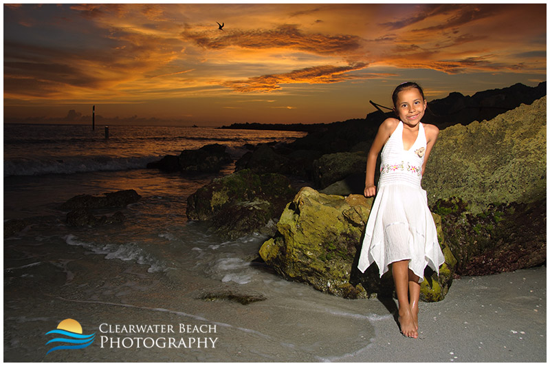 Portrait of Young girl by rocks on Clearwater Beach