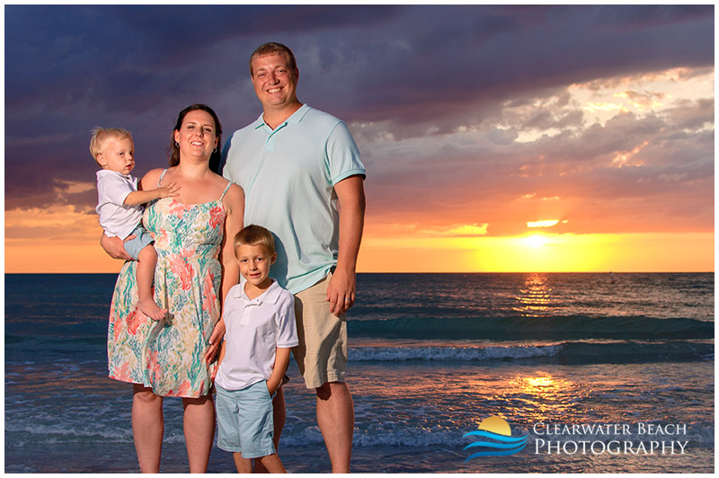 Family standing in front of stormy Clearwater Florida Sunset