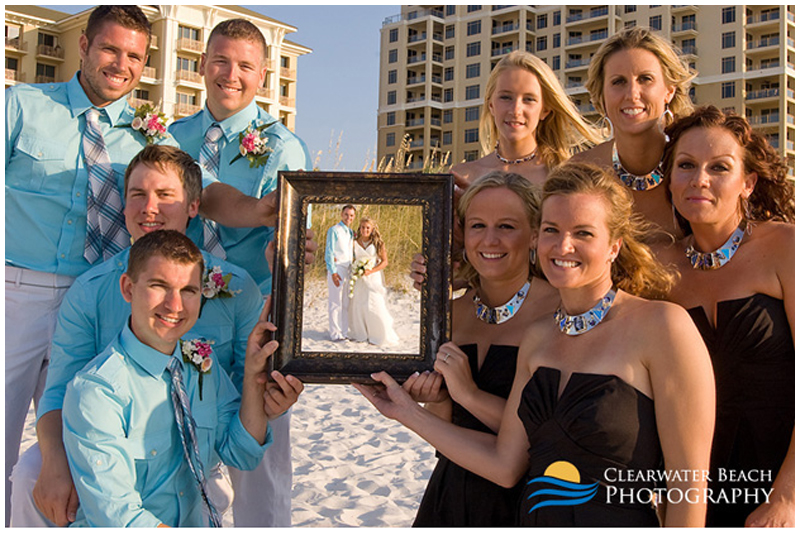 Clearwater Beach Wedding Portrait of Bridal Party holding Frame