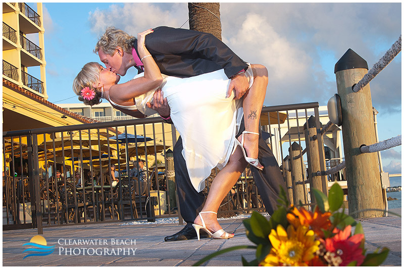 Clearwater Beach Wedding Portrait of Groom dipping Bride